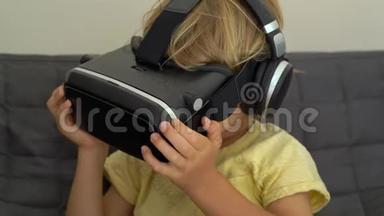 一个小男孩的特写镜头使用虚拟现实耳机。 虚拟现实眼镜。 虚拟现实概念。 儿童和现代技术